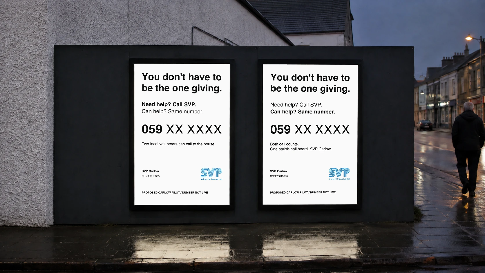 Two SVP posters on an Irish street read “You don’t have to be the one giving.” Both display help and giving invitations and the non-live placeholder 059 XX XXXX. The left describes local visits; the right the public board.